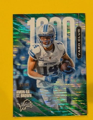2026 Topps Football Amon-Ra St. Brown 1000 Yard Club Case Hit SSP Green /99 #1YC-24